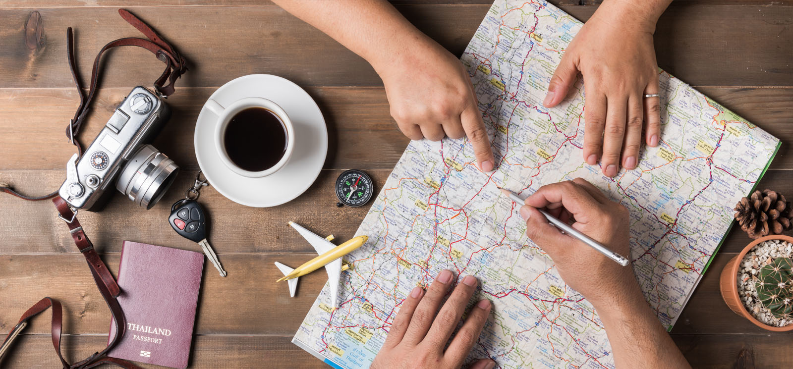 couple planning vacation trip with map