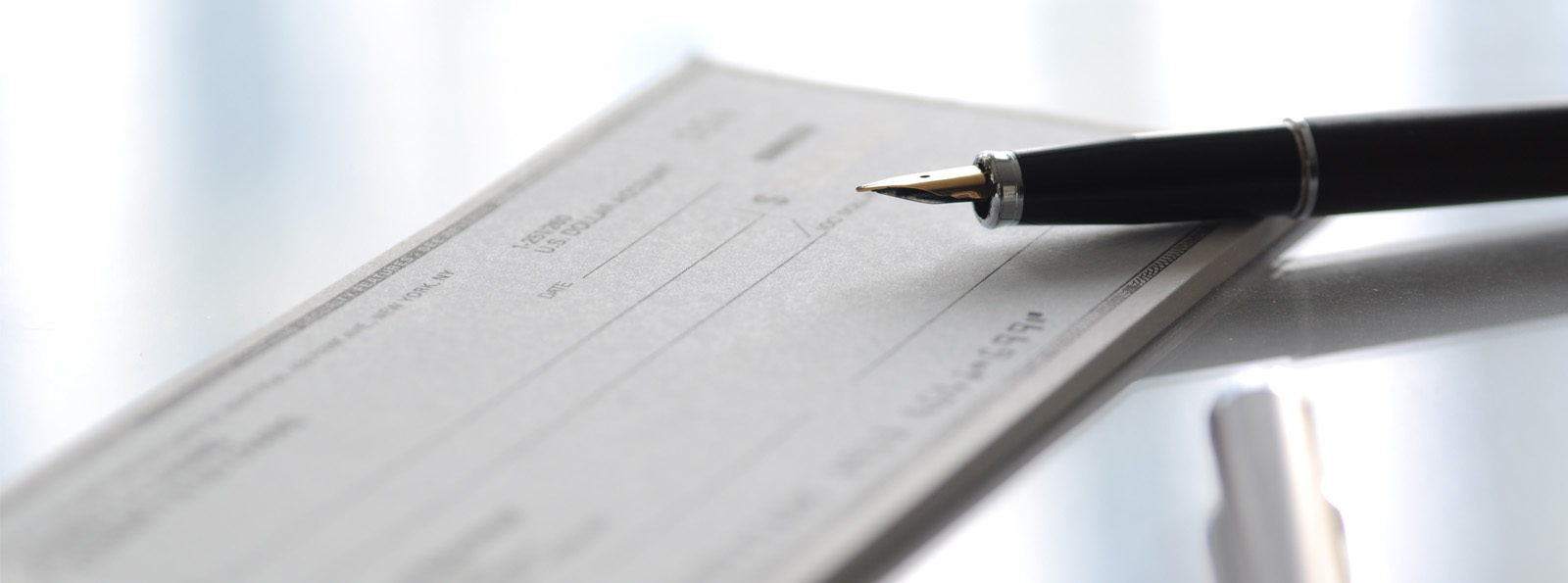 book of checks with pen