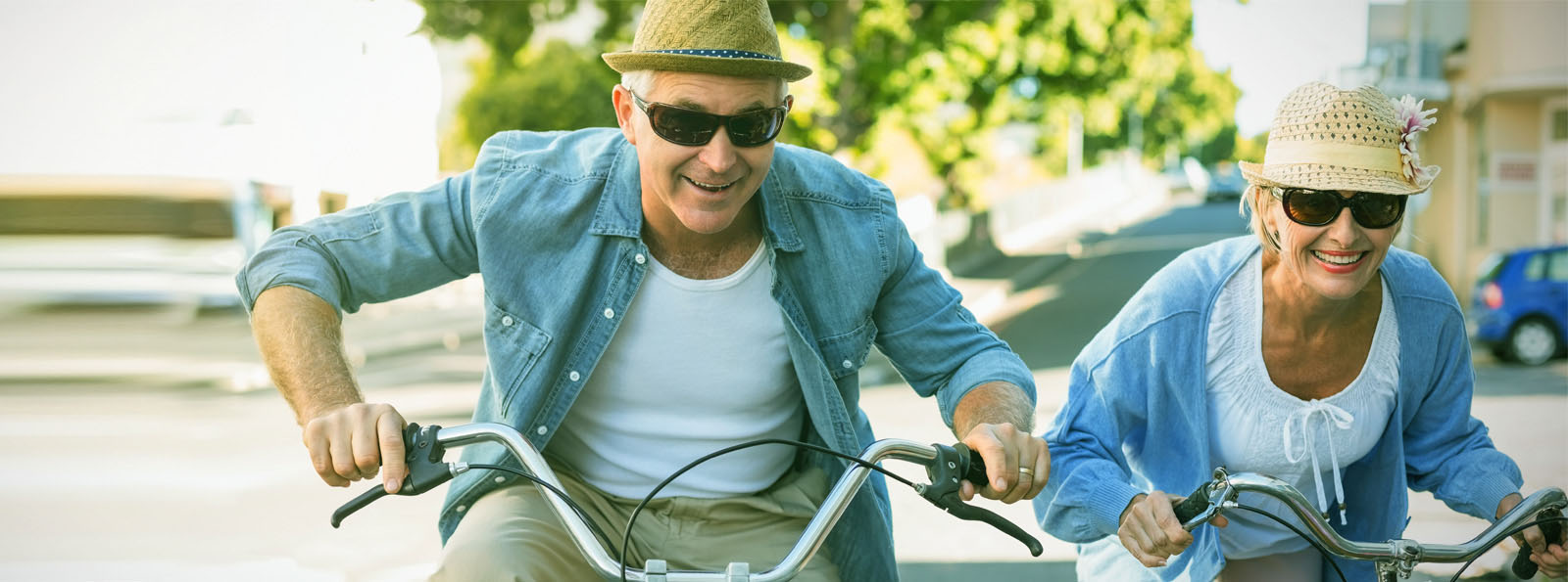 older couple happily riding bicycles together